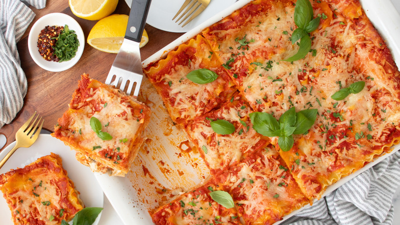 lasagna in a white baking pan