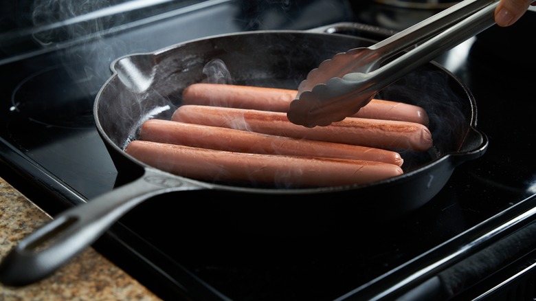 hot dogs in cast iron pan