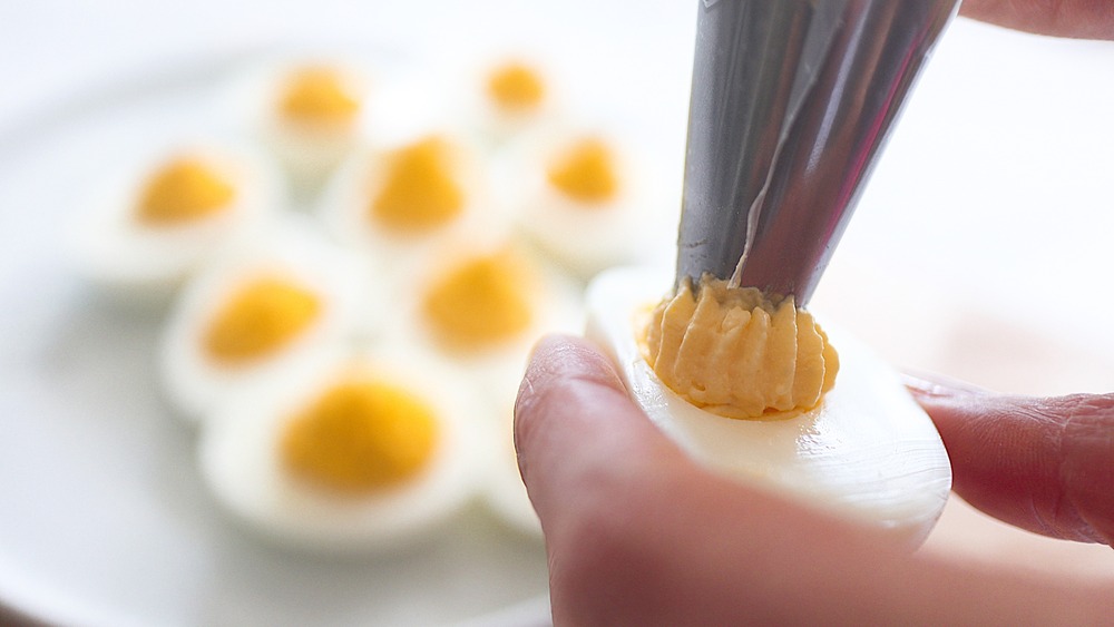 deviled eggs being prepared
