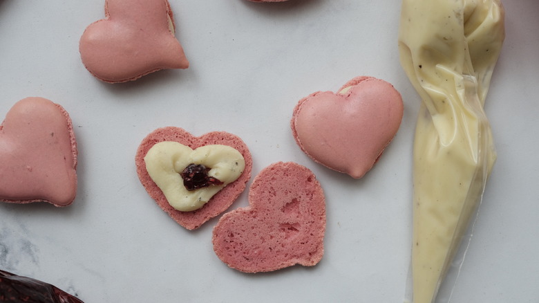 filling heart-shaped macaron shells