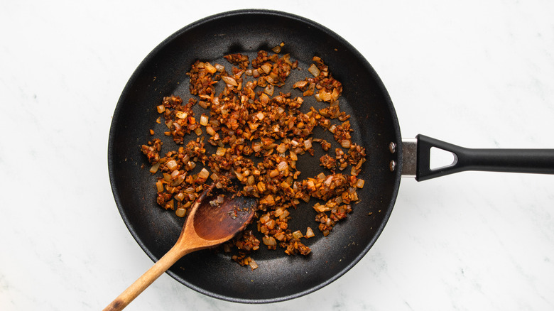 Seasoned vegetables sauteing in frying pan