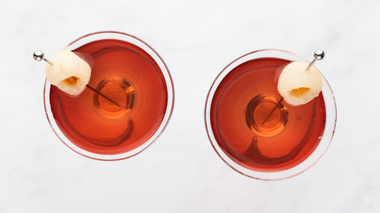 Top down view of two raspberry lychee martini cocktails
