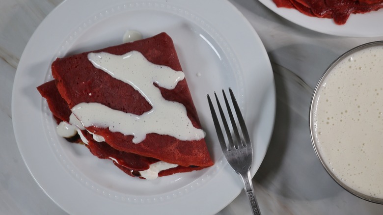 folded red velvet crepe on plate