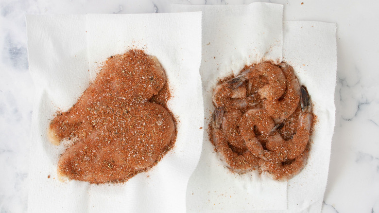 Chicken and shrimp coated in seasoning