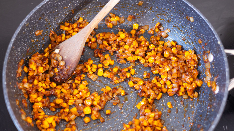 toasted corn, onion, garlic in pan
