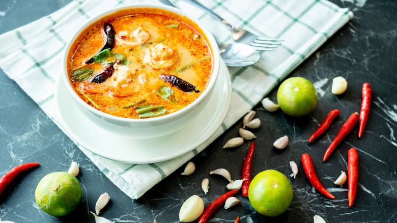 Thai red curry in bowl surrounded by ingredients
