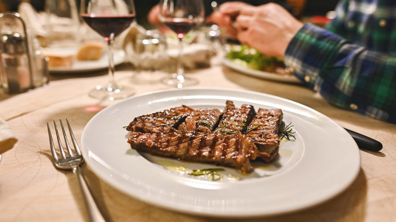 Steak and wine on fancy restaurant table
