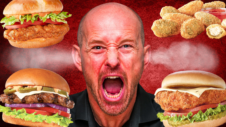person making painful face fast food 